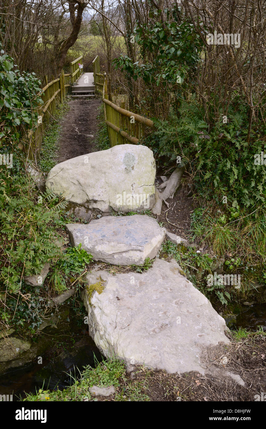 Large natural stone slabs forming a small bridge, steps and stile on a section of public footpath, llanrhystud, Wales, UK Stock Photo