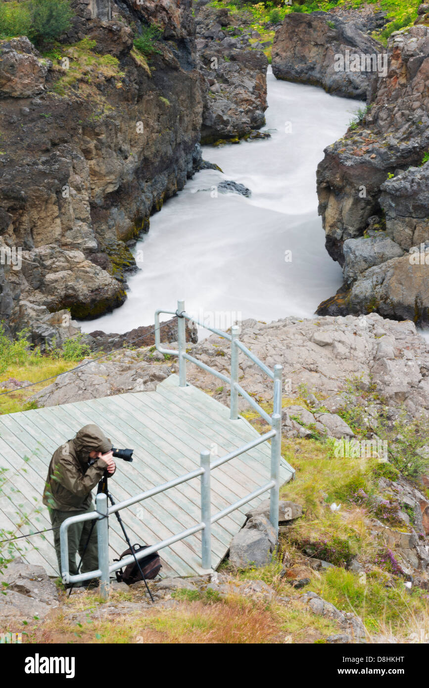 Iceland, photographer at Barnafoss waterfall Stock Photo