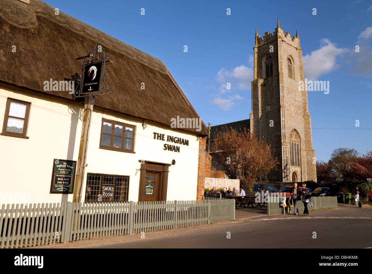 The Ingham Swan Inn pub, and Holy Trinity church, Ingham village, Norfolk, East Anglia England UK Stock Photo