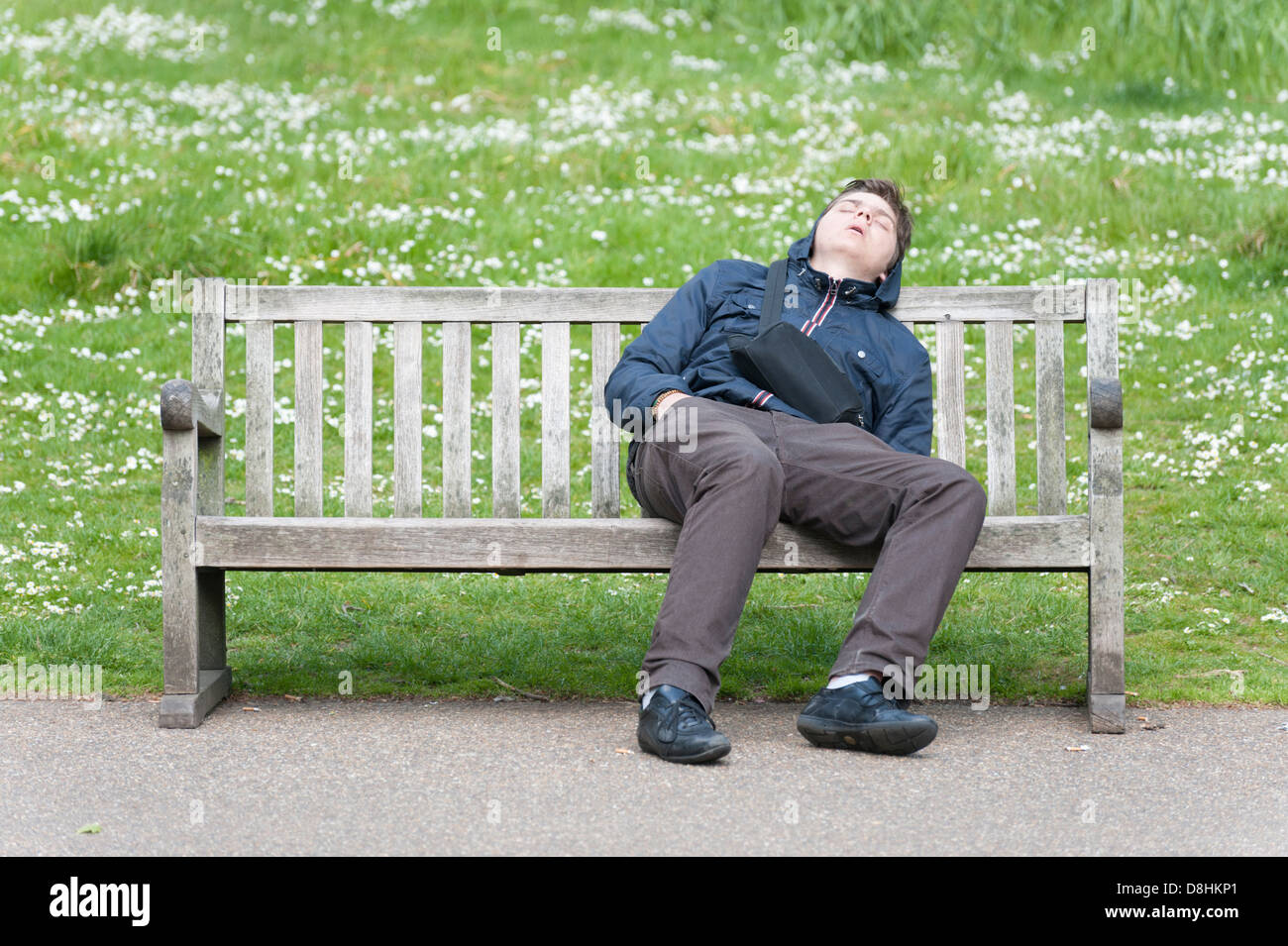 Man asleep on bench hi-res images photography - Alamy stock and