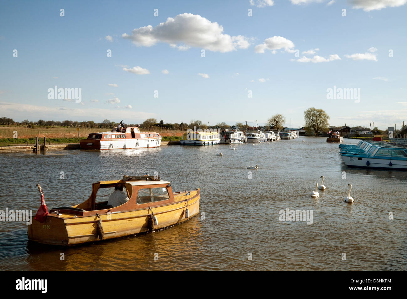 Norfolk Broads boats on the River Thurne at Potter Heigham on a spring evening, Norfolk , UK