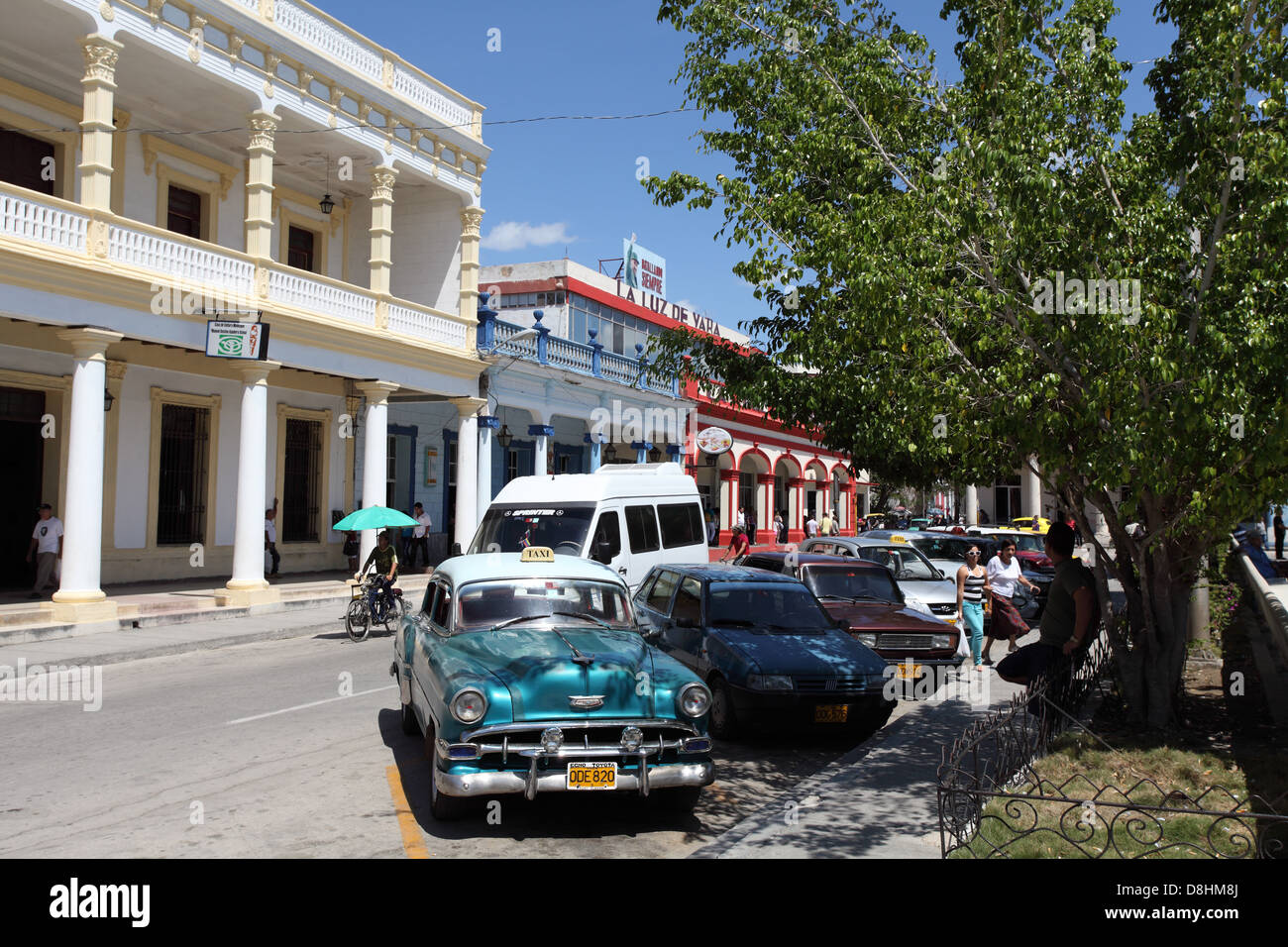 Holguin city centre with old classic American cars parked in the street, Cuba Stock Photo