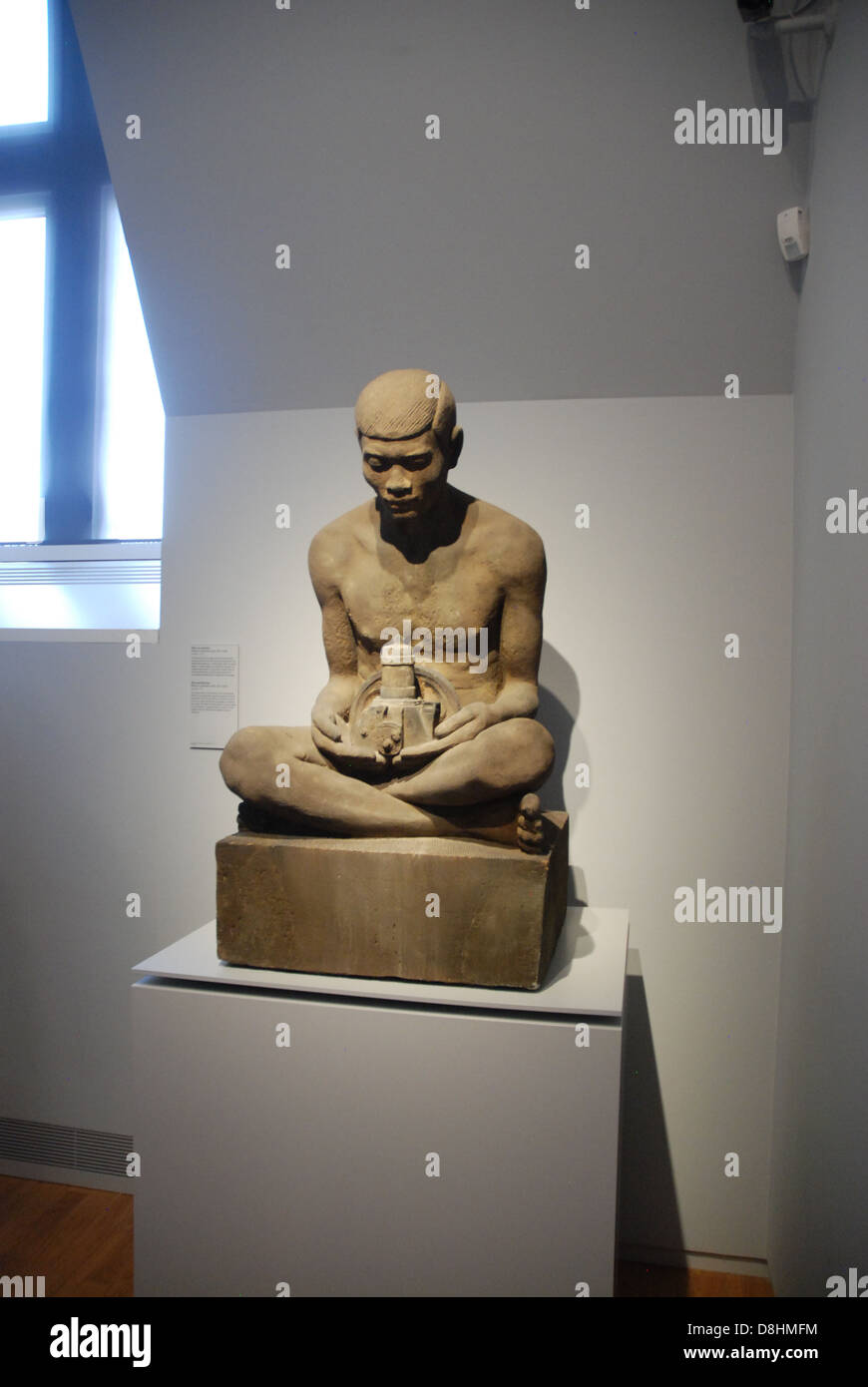 Java Man with engine block in lap rijksmuseum Amsterdam netherlands Stock Photo