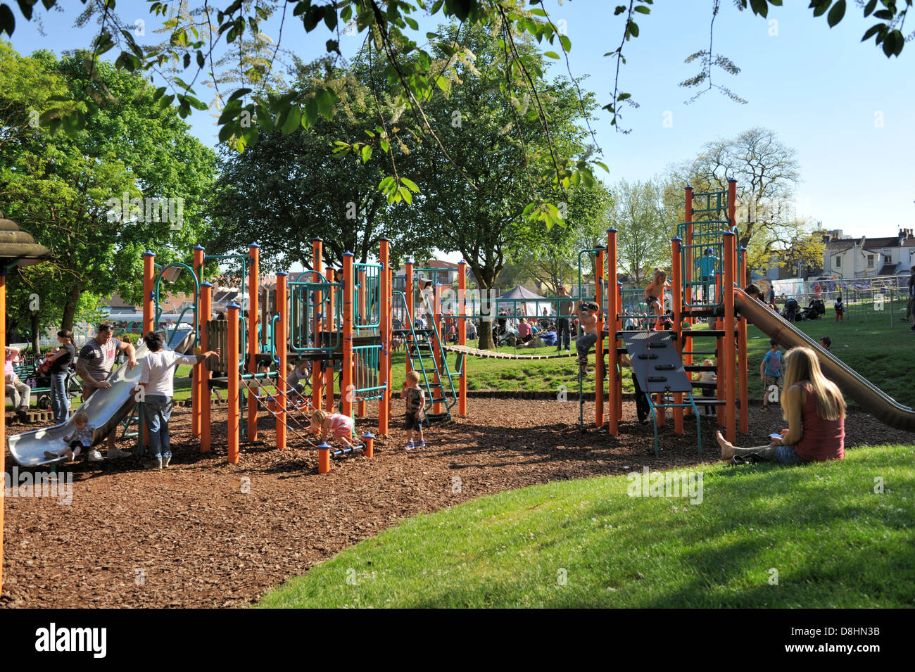 Children’s play area with slide and climbing frame in Park Stock Photo