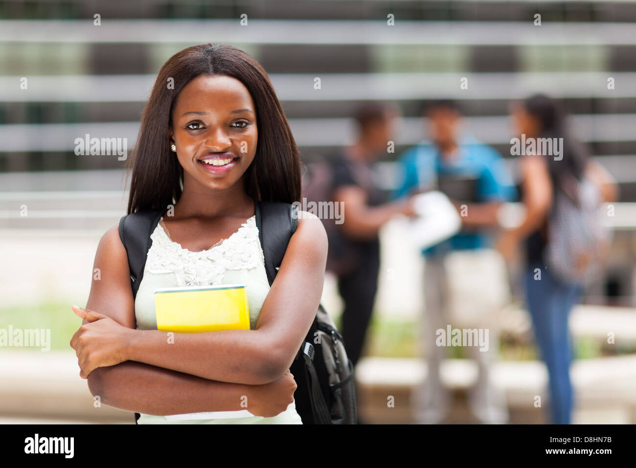 happy african college girl outdoors on modern campus Stock Photo - Alamy