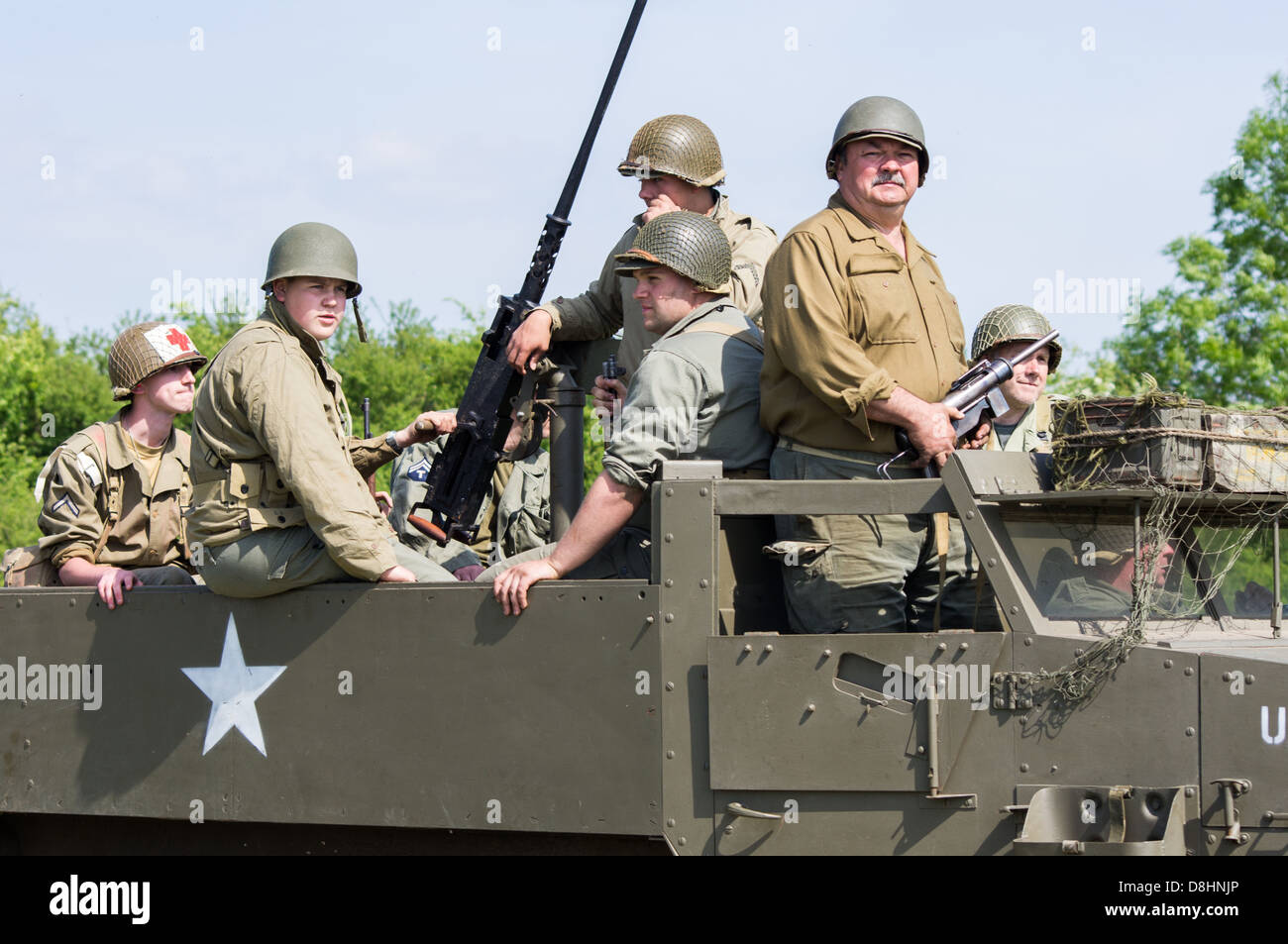 American soldiers being carried in a half track personnel carrier