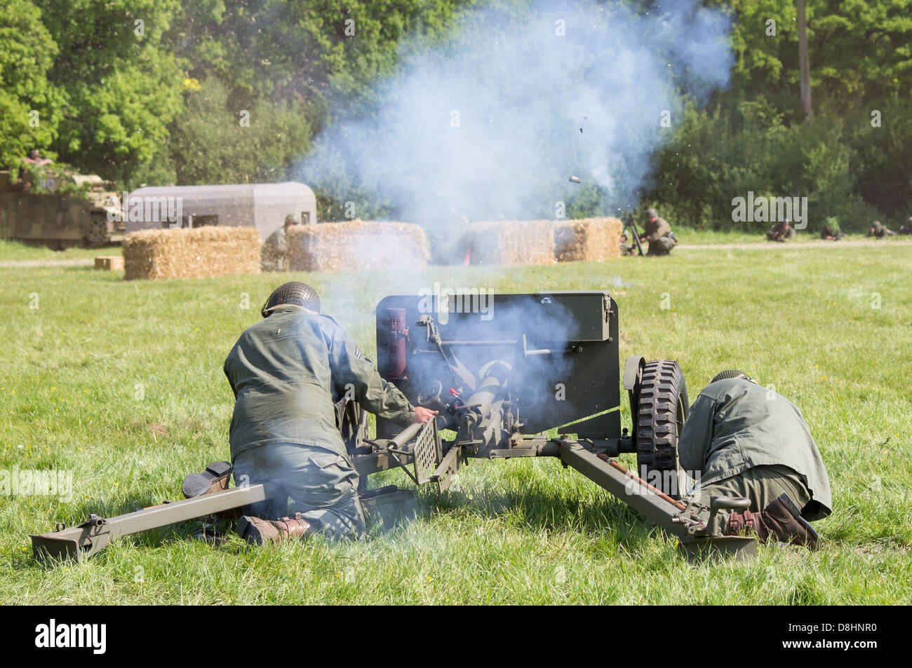 American Anti-Tank gunners fire their gun at advancing Germans during the Overlord re-enactment display at Denmead, 2013 Stock Photo