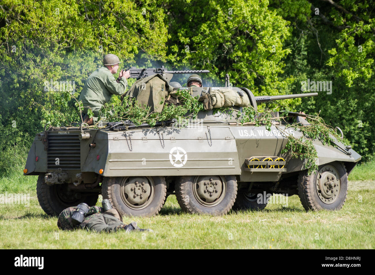 Overlord, D-Day re-enactment at Denmead 2013. American M8 Greyhound Armoured car advancing on German lines. Stock Photo