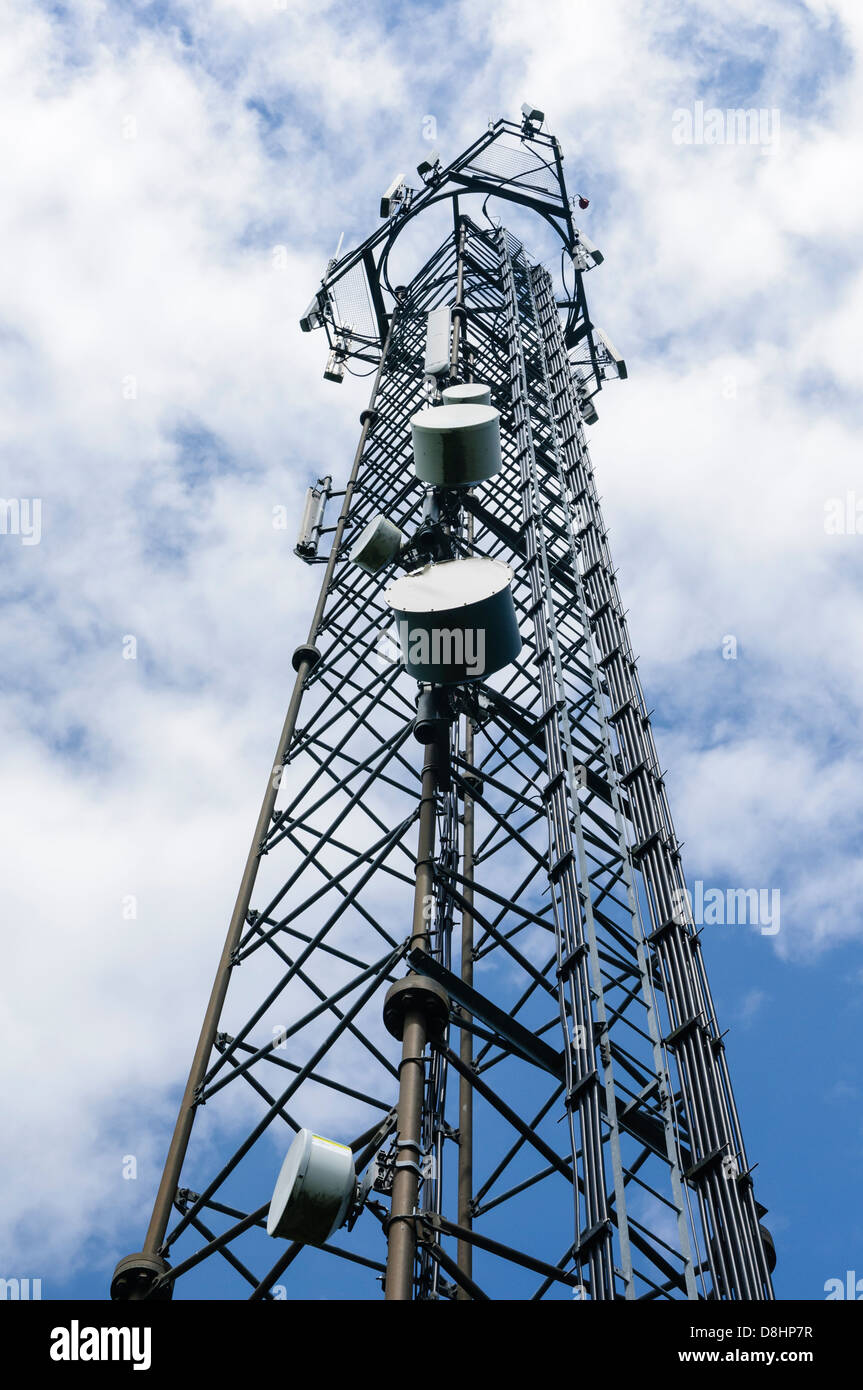 Mobile (cell) phone radio transmission tower with microwave dishes and cellular antannae Stock Photo