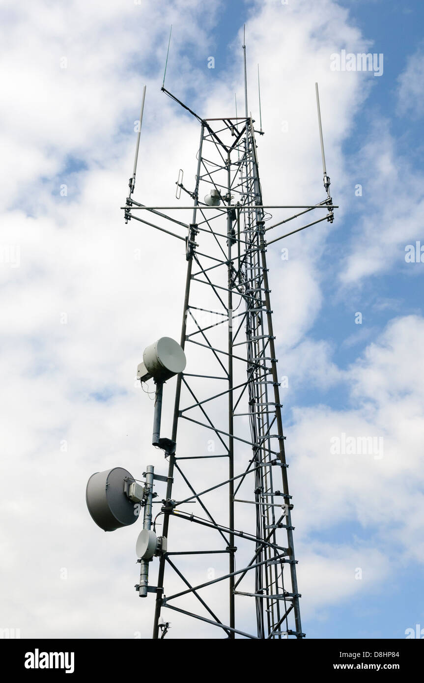 VHF and UHF radio transmission tower with microwave dishes, dipole (half and quarter wave) and folded dipole antannae Stock Photo