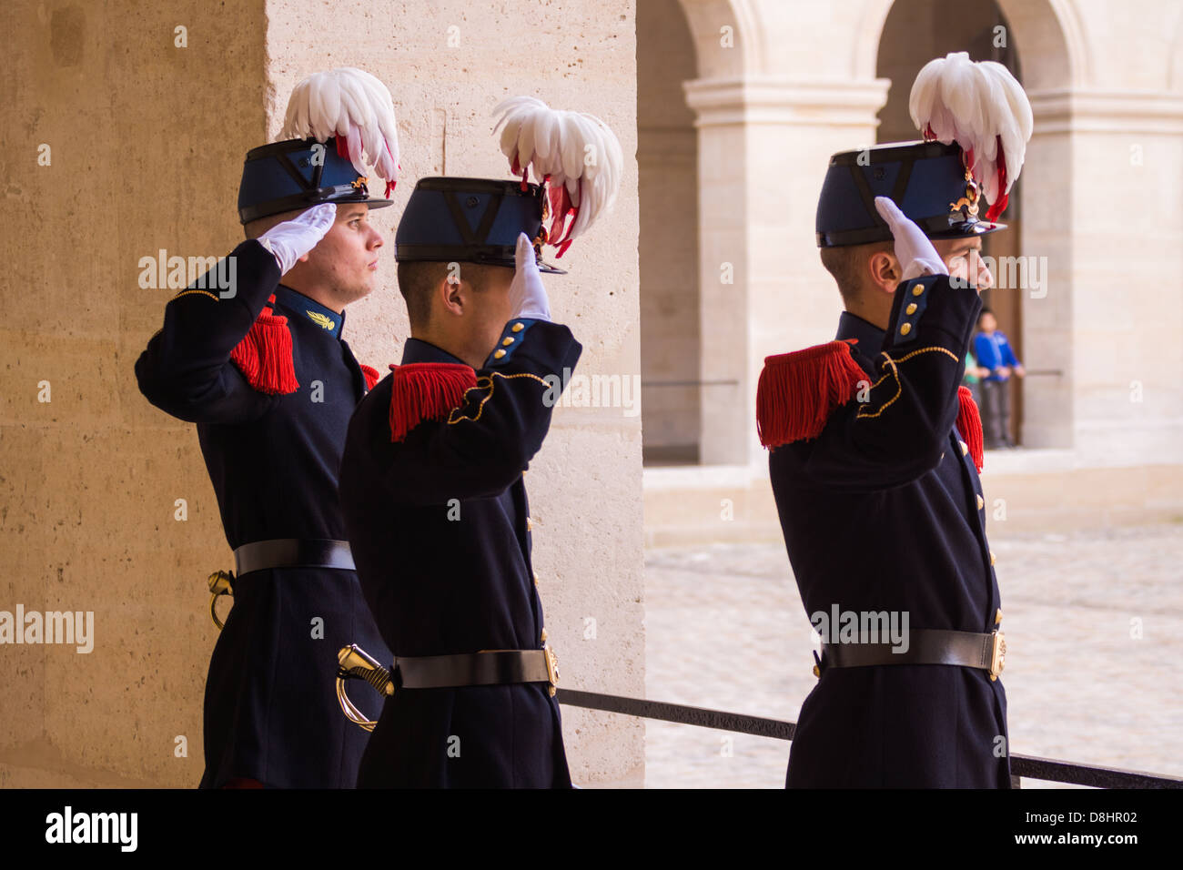 Les Invalides, Paris, France. Soldiers salute as the French anthem is