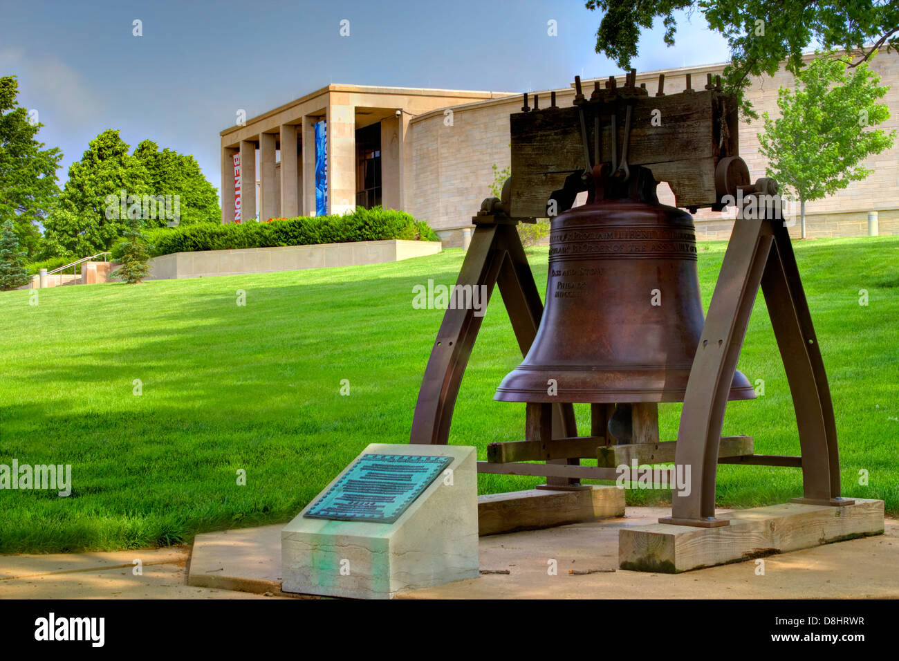 Replica of Liberty Bell with Truman Library in background Stock Photo