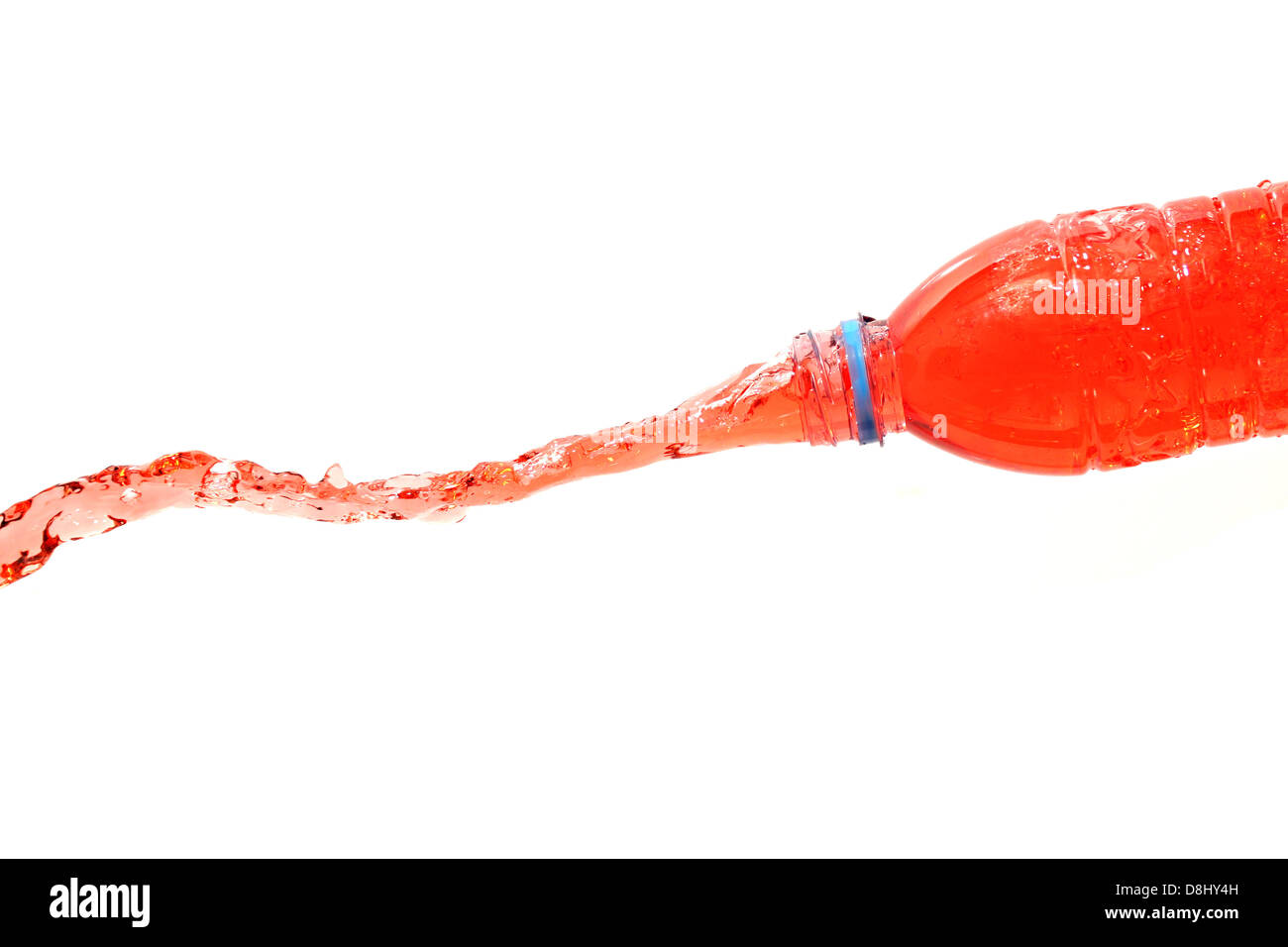 The Red water that spread out from the bottle on The white Background. Stock Photo