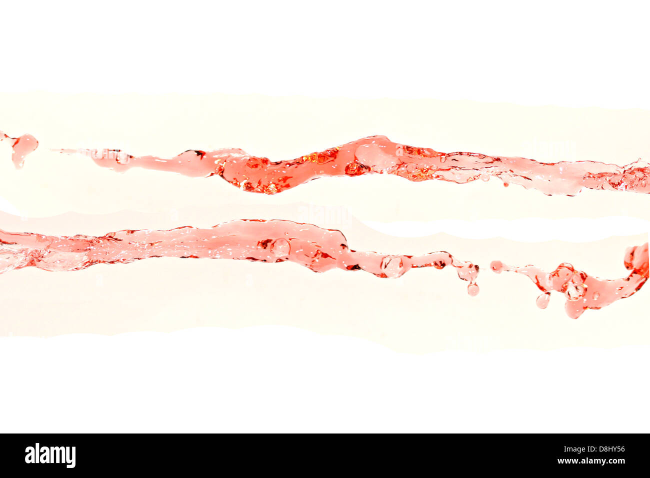 The Red water that spread on The white Background. Stock Photo