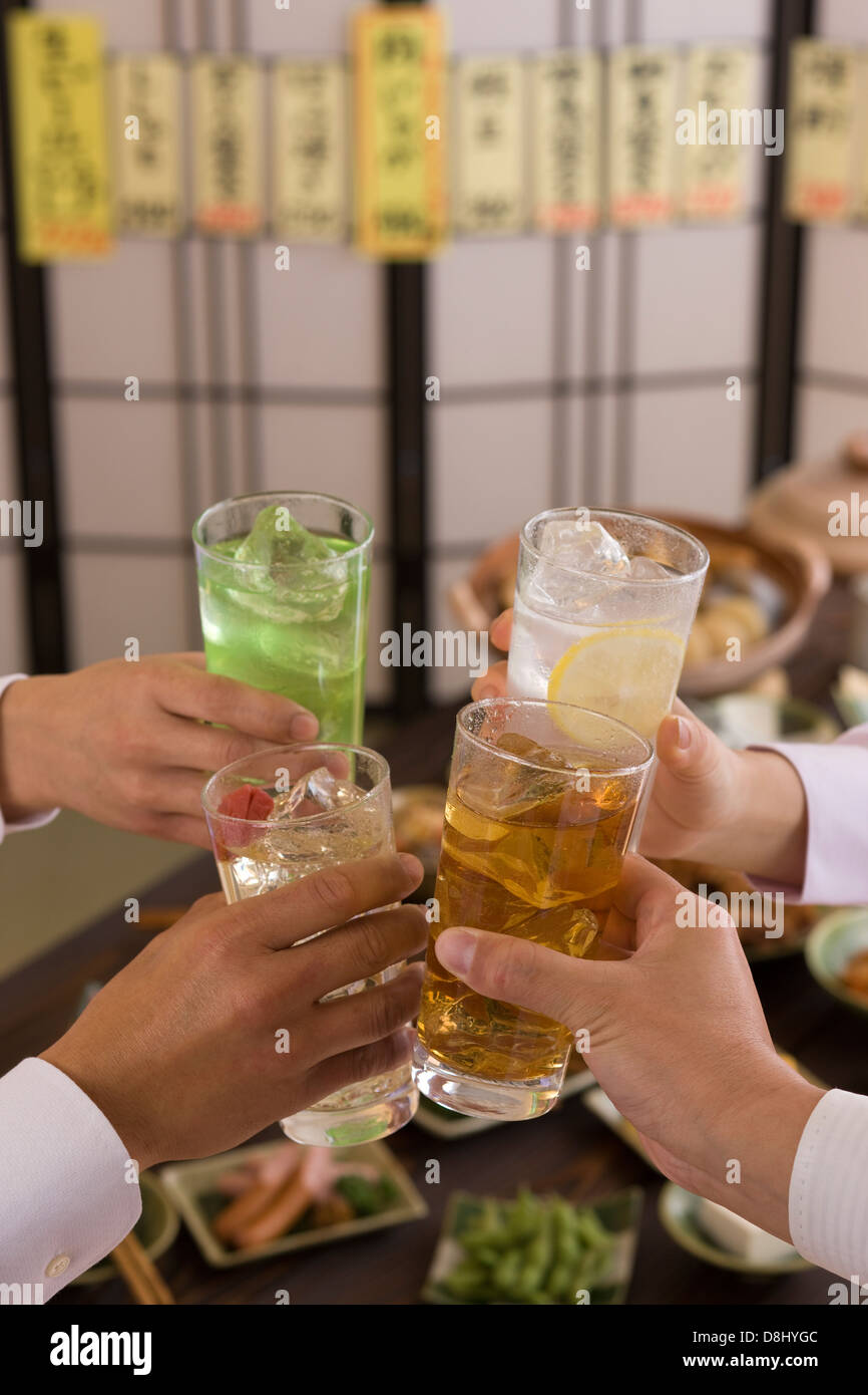 Four People Toasting with Various Chu-Hi at Izakaya Stock Photo
