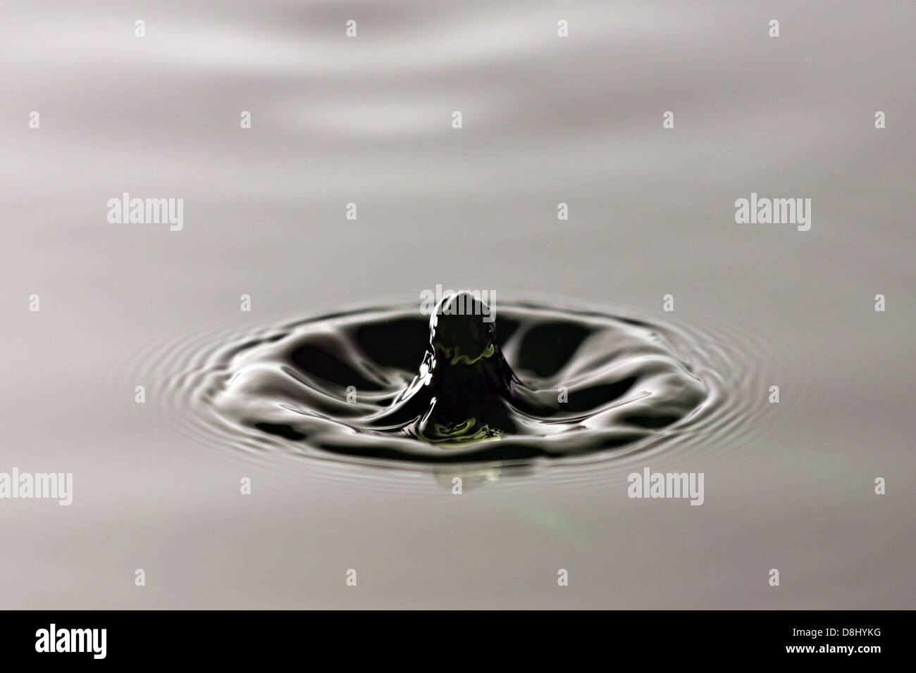This Images that are floating above the water drops surface. Stock Photo