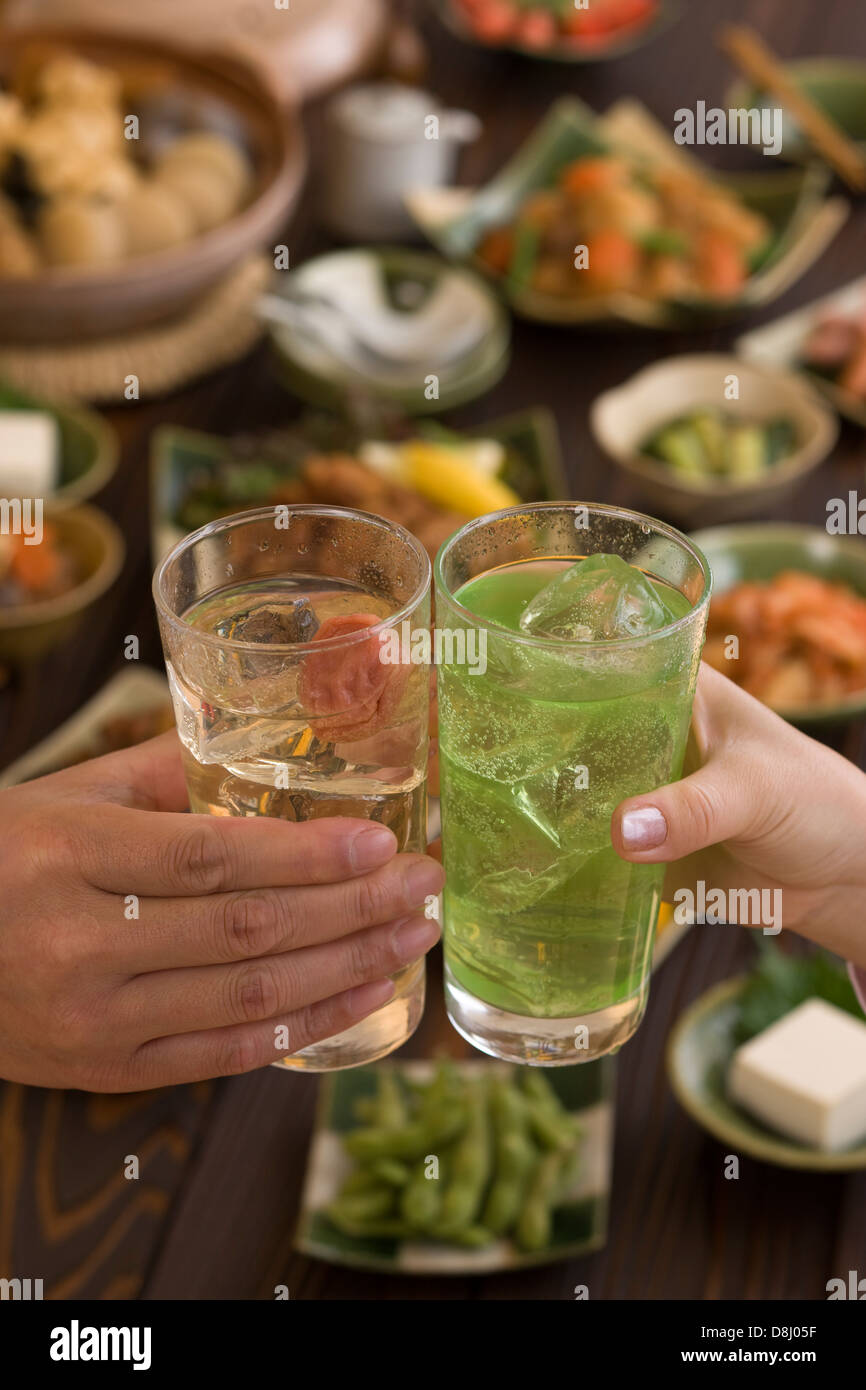 Two People Toasting with Chu-Hi at Izakaya Stock Photo