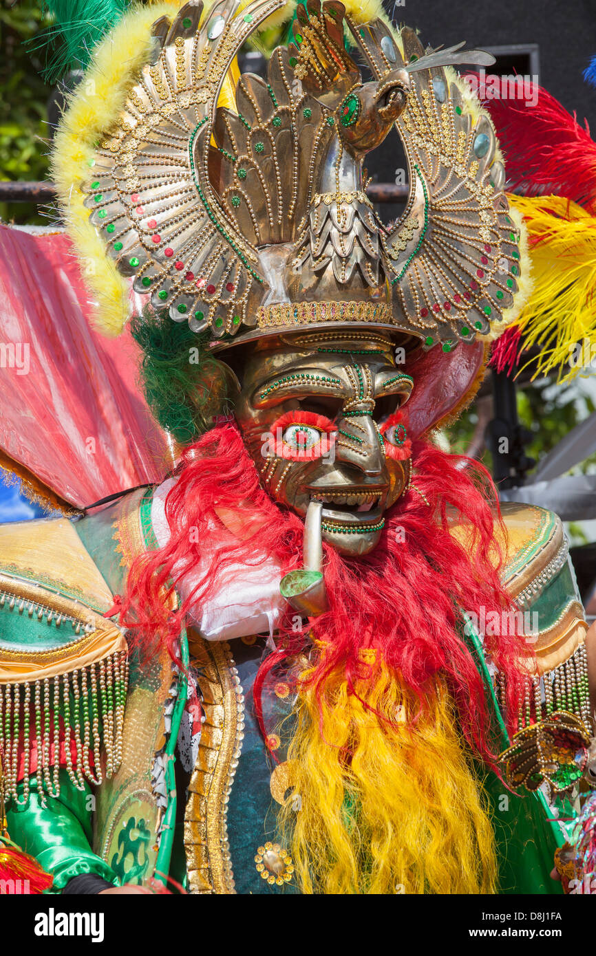 Man wearing elaborate costume, mask and headdress for  annual Carnaval Grand Parade in San Francisco's Mission District. Stock Photo