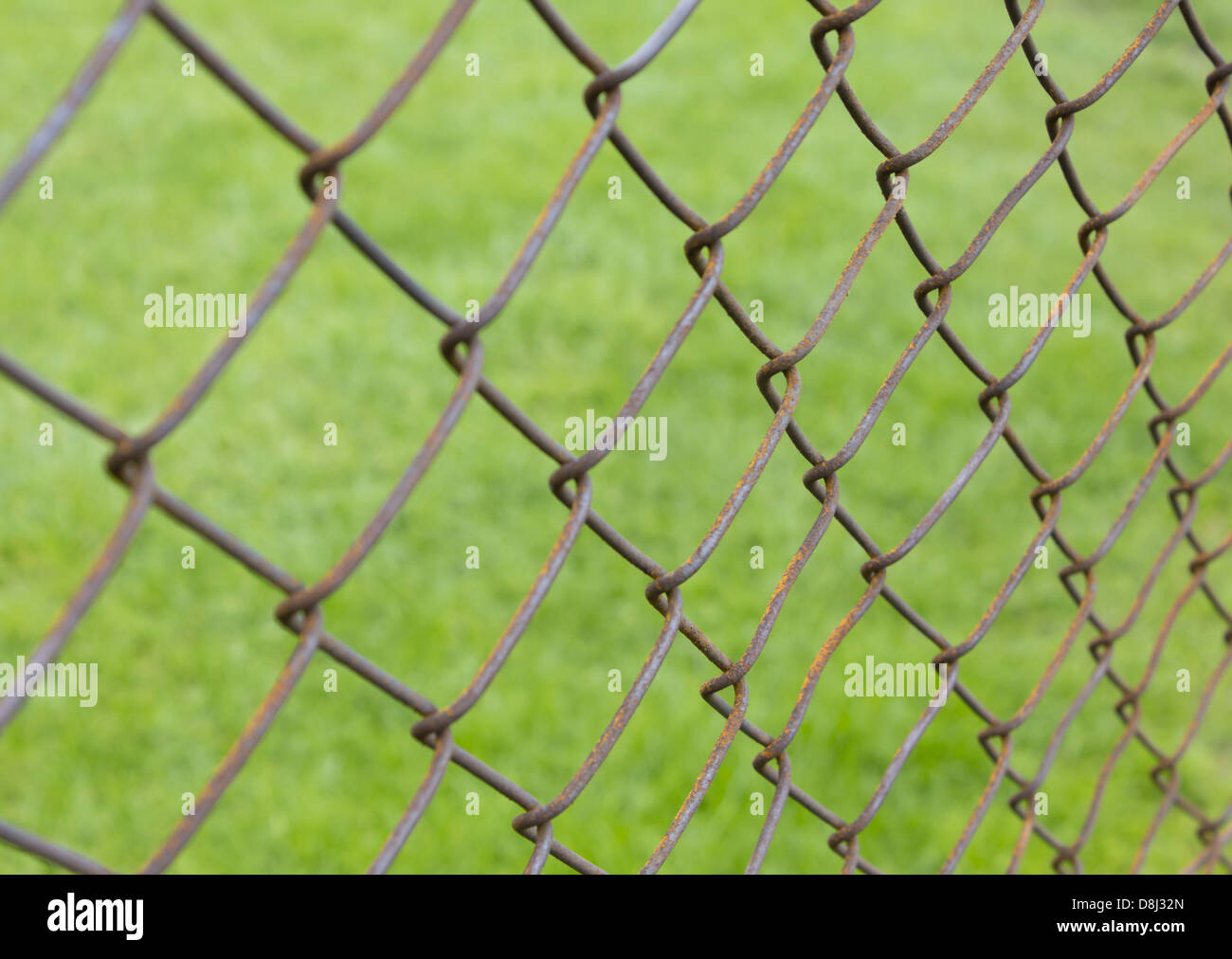Wire fence and lawn Stock Photo - Alamy