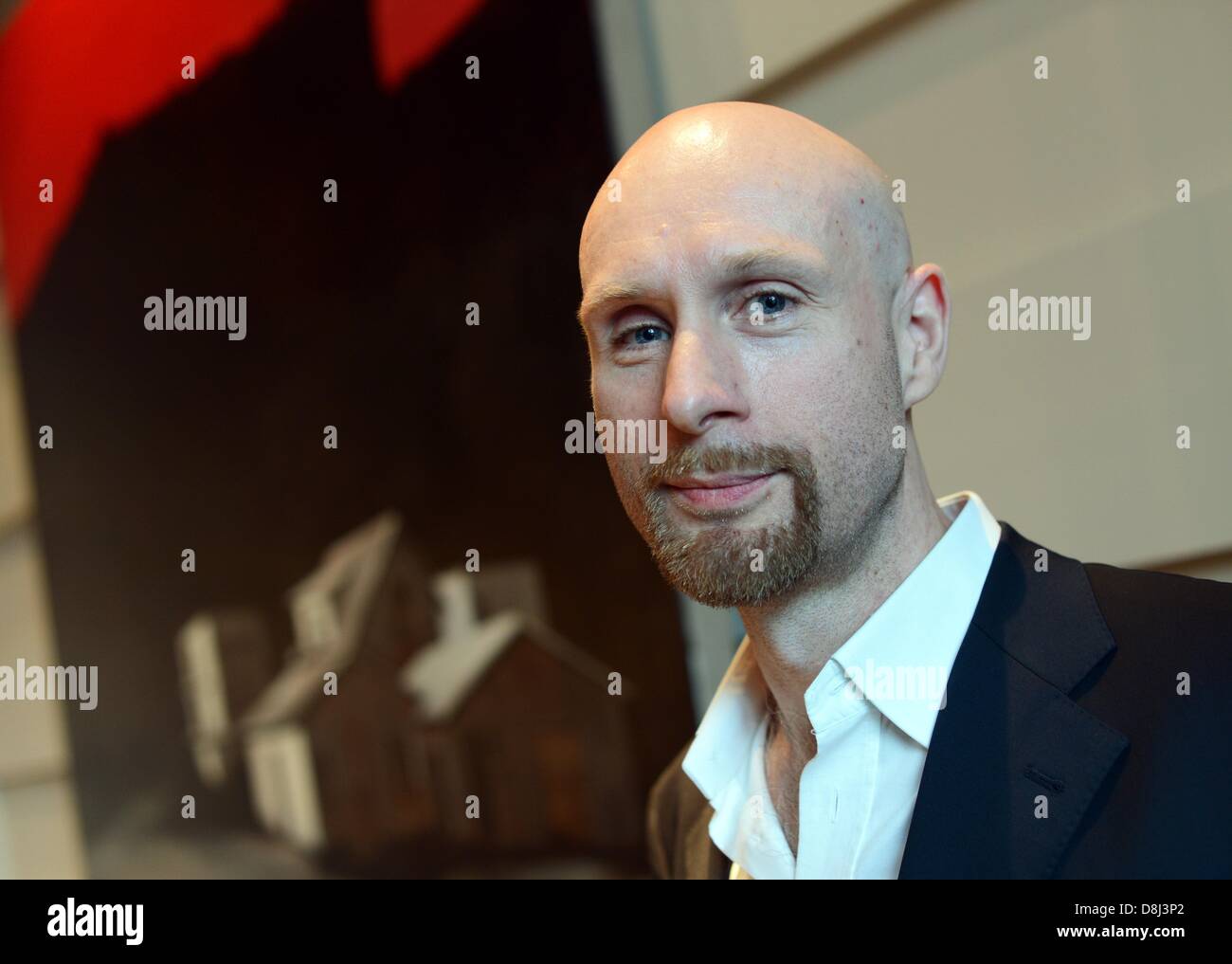 Artist Roman Lipski poses for the cameras during the vernissage of his