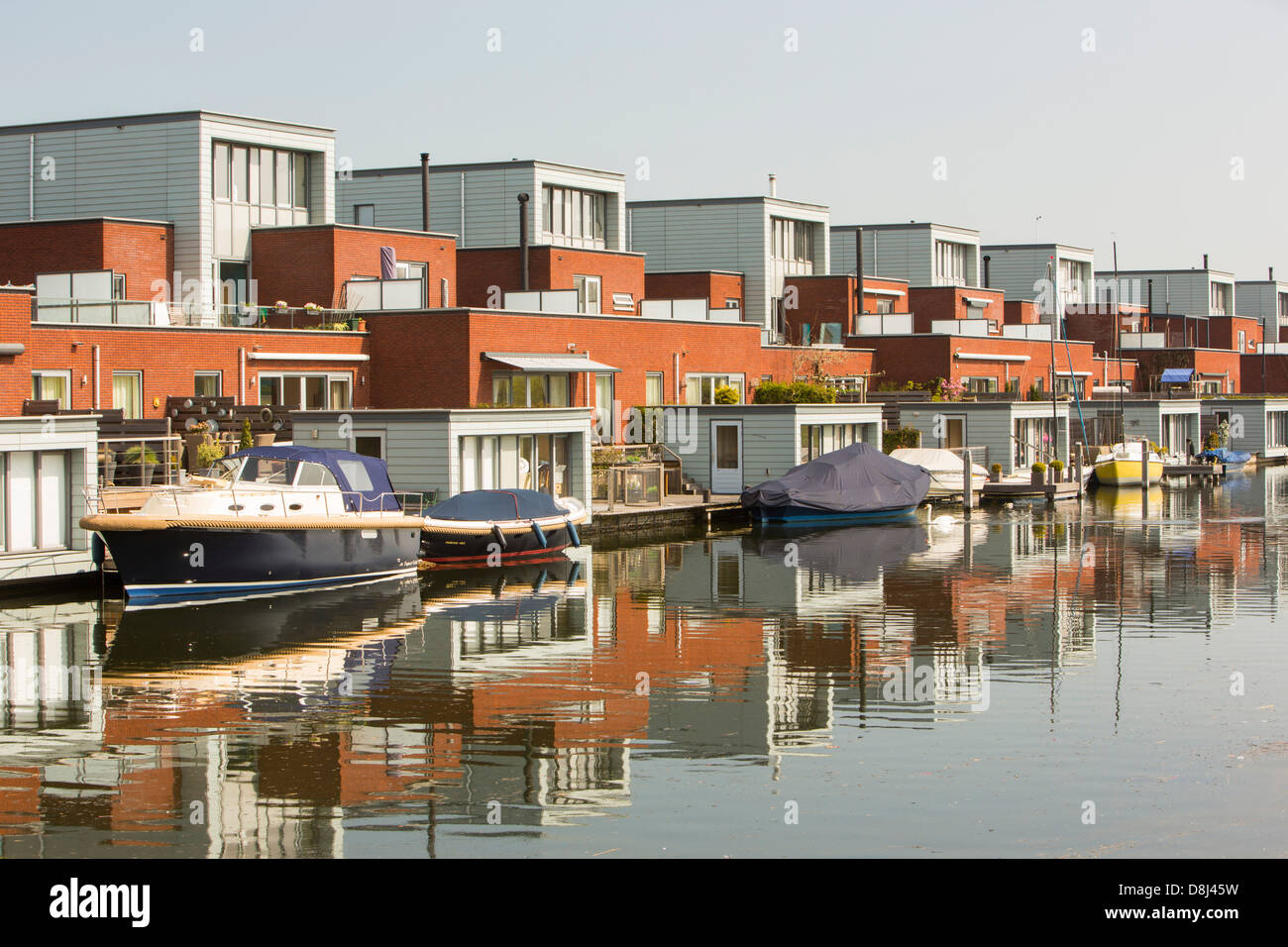 Houses in Almere next to canal. It is the Netherlands youngest town, in Flevoland Stock Photo