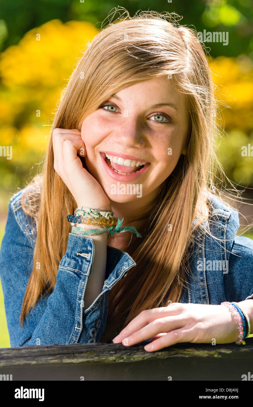 Portrait of charming happy young girl on sunny day Stock Photo