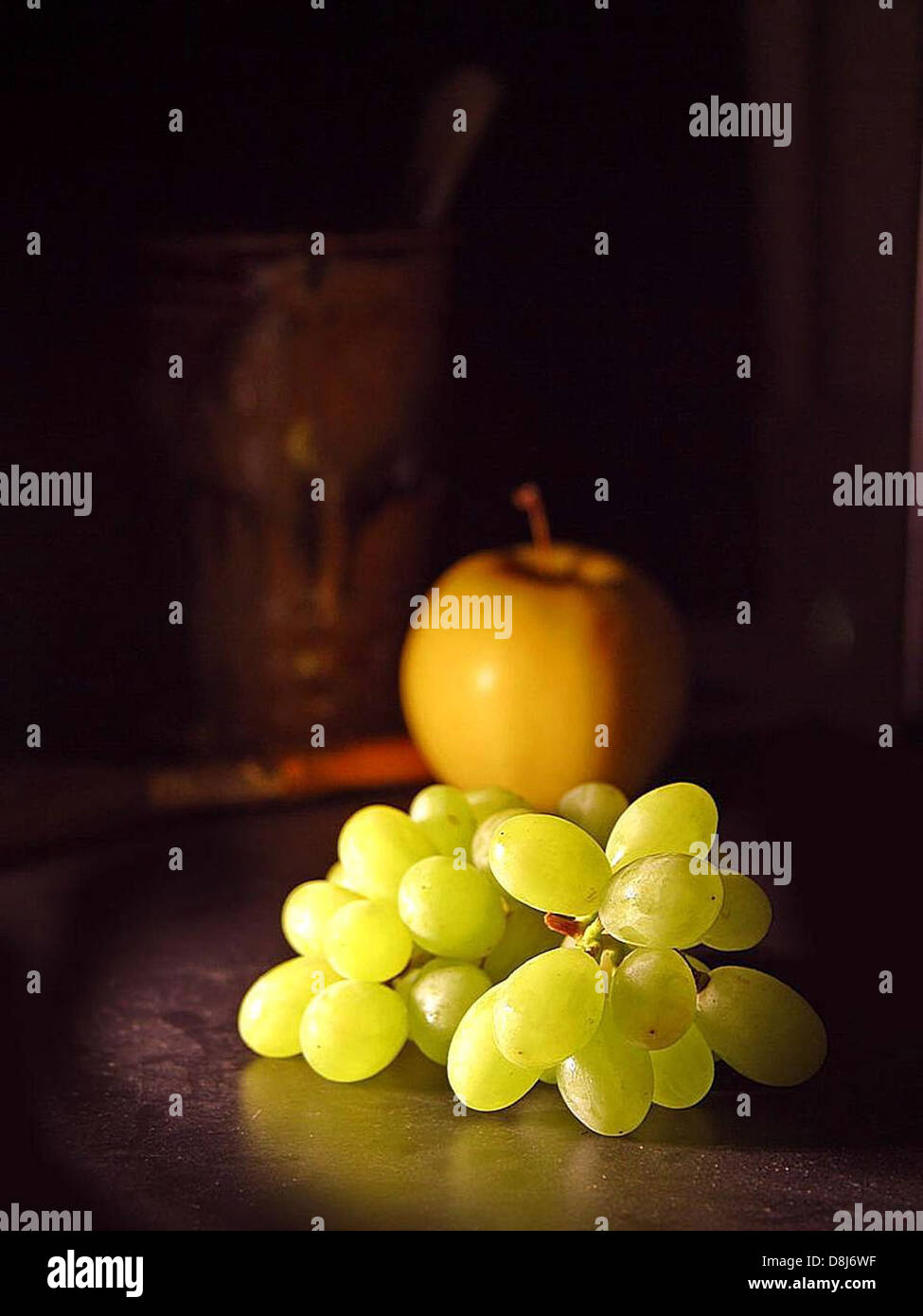 Picture Idea: This Image Shows A Combination Of Grapes And An Apple