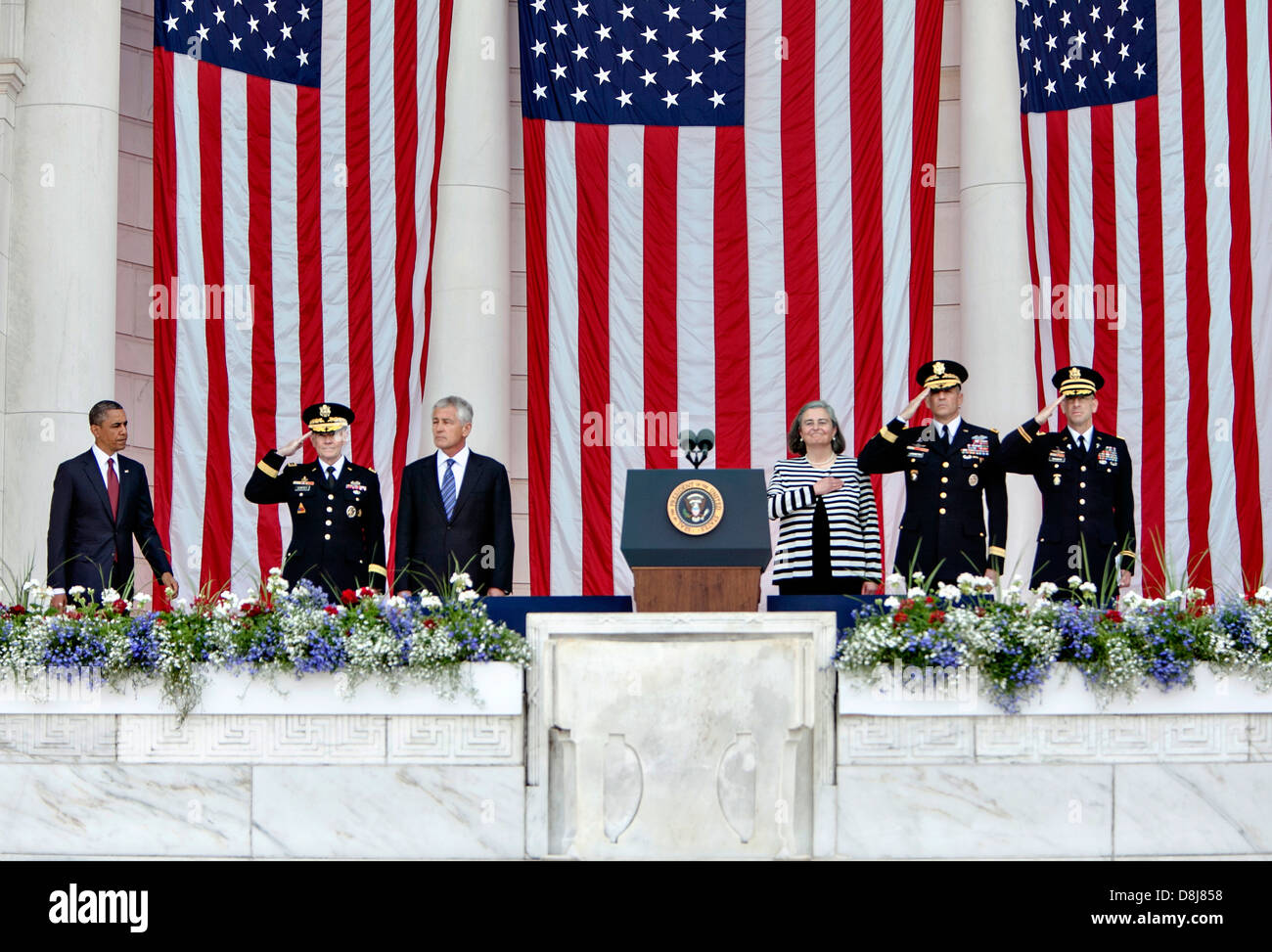 US President Barack Obama arrives to deliver a Memorial Day address at the Memorial Amphitheater at Arlington National Cemetery May 27, 2013 in Arlington , VA. Joining him: left, Gen. Martin Dempsey, chairman of the Joint Chiefs of Staff; Secretary of Defense Chuck Hagel; Kathryn Condon, the director of the Army National Cemeteries; Maj. Gen. Michael Linnington, the commanding general of the Military District of Washington; and Col. Michael Brainerd, chaplain. Stock Photo