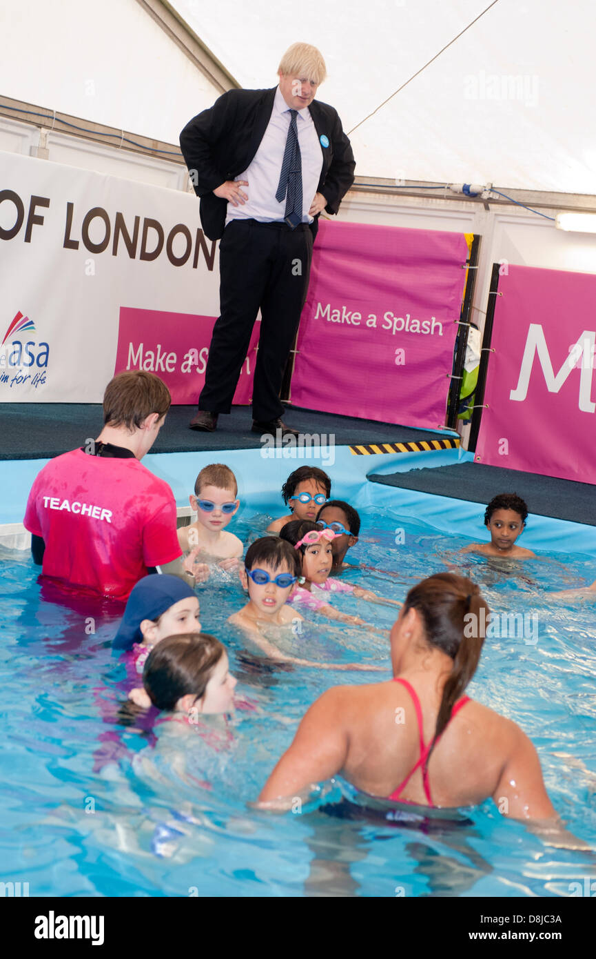 London, UK. 30th May 2013. Mayor of London, Boris Johnson joins team GB synchronised swimming stars Katie Dawkins and Jazmine Stansbury and kids of the Camden’s Maria Fidelis School, as part of the 'Make a splash' programme to encourage more people into swimming. Credit:  Piero Cruciatti/Alamy Live News Stock Photo