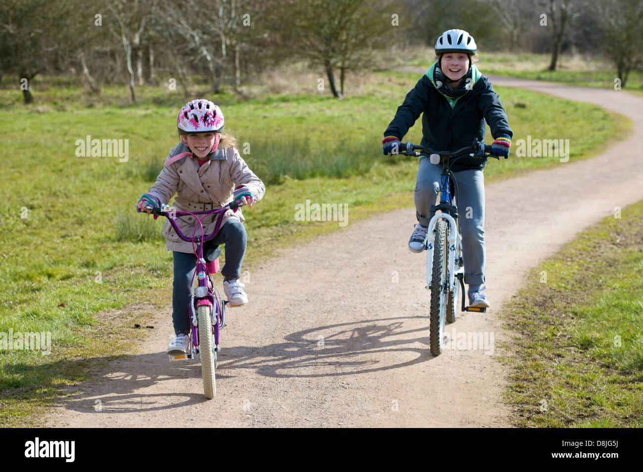 Boy and girl riding bikes hires stock photography and images Alamy