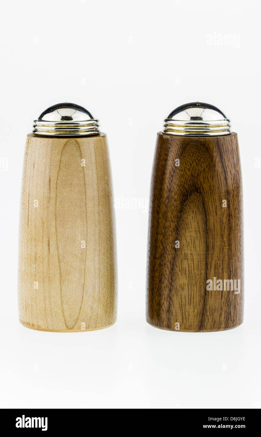 Wood salt and pepper shakers on a white background. Stock Photo
