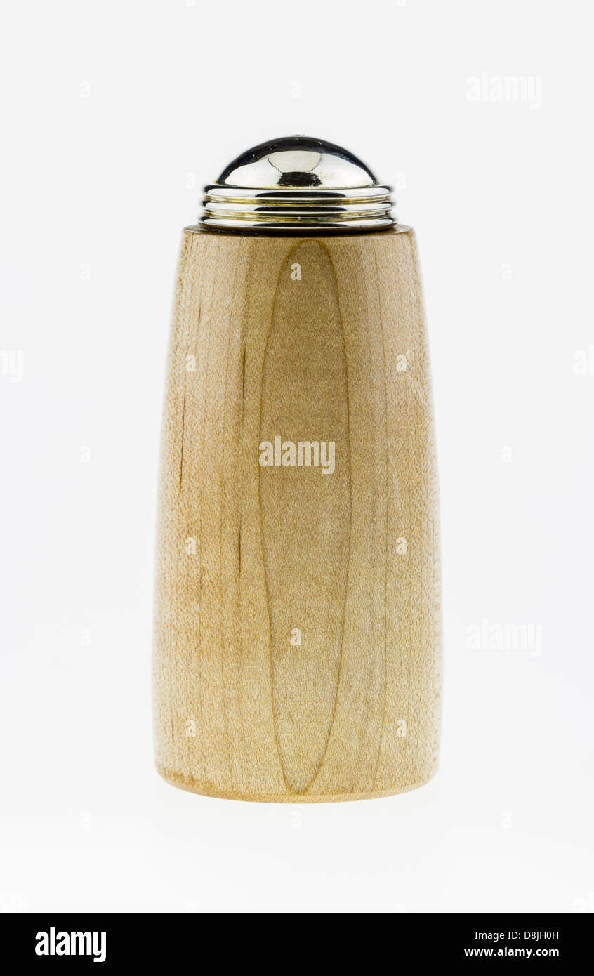A light colored wood salt shaker on a white background. Stock Photo