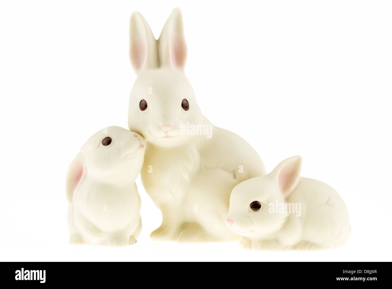 Three ceramic bunnies isolated on a white background. Stock Photo