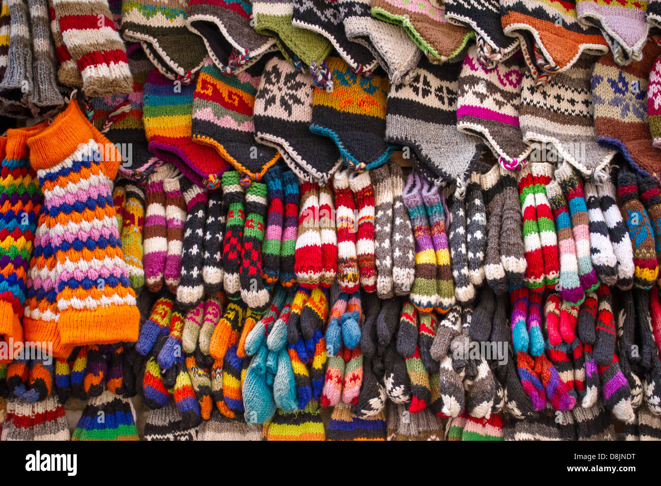 Colorful woolen socks, hats and gloves background Stock Photo