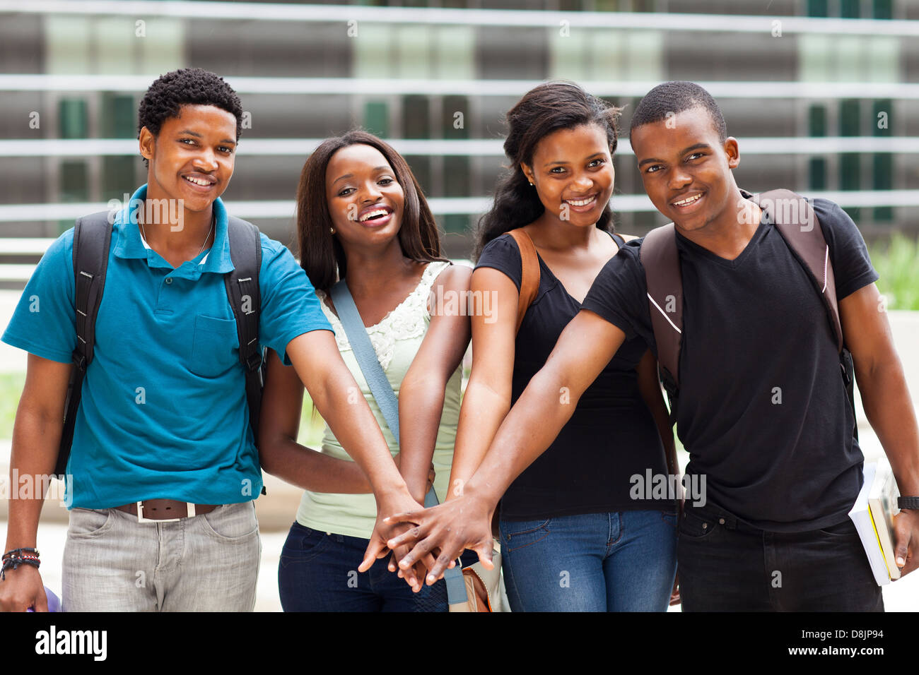 group of african college students putting hands together Stock Photo ...