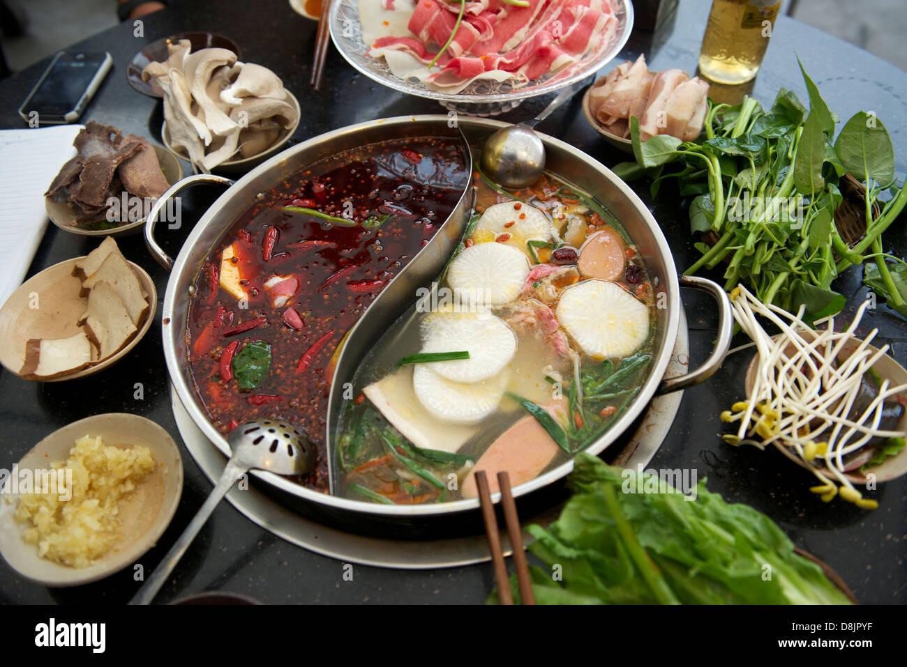 Chongqing hot-pot in a restaurant Stock Photo - Alamy