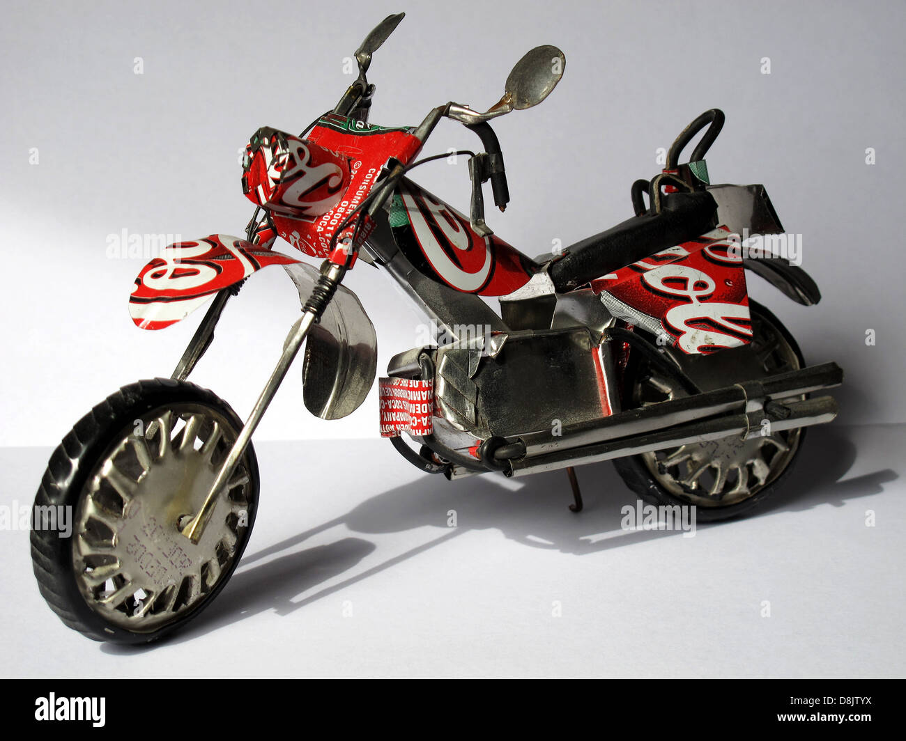 Motorcycle toy,recycling cans of CocaCola,Madagascar,Africa Stock