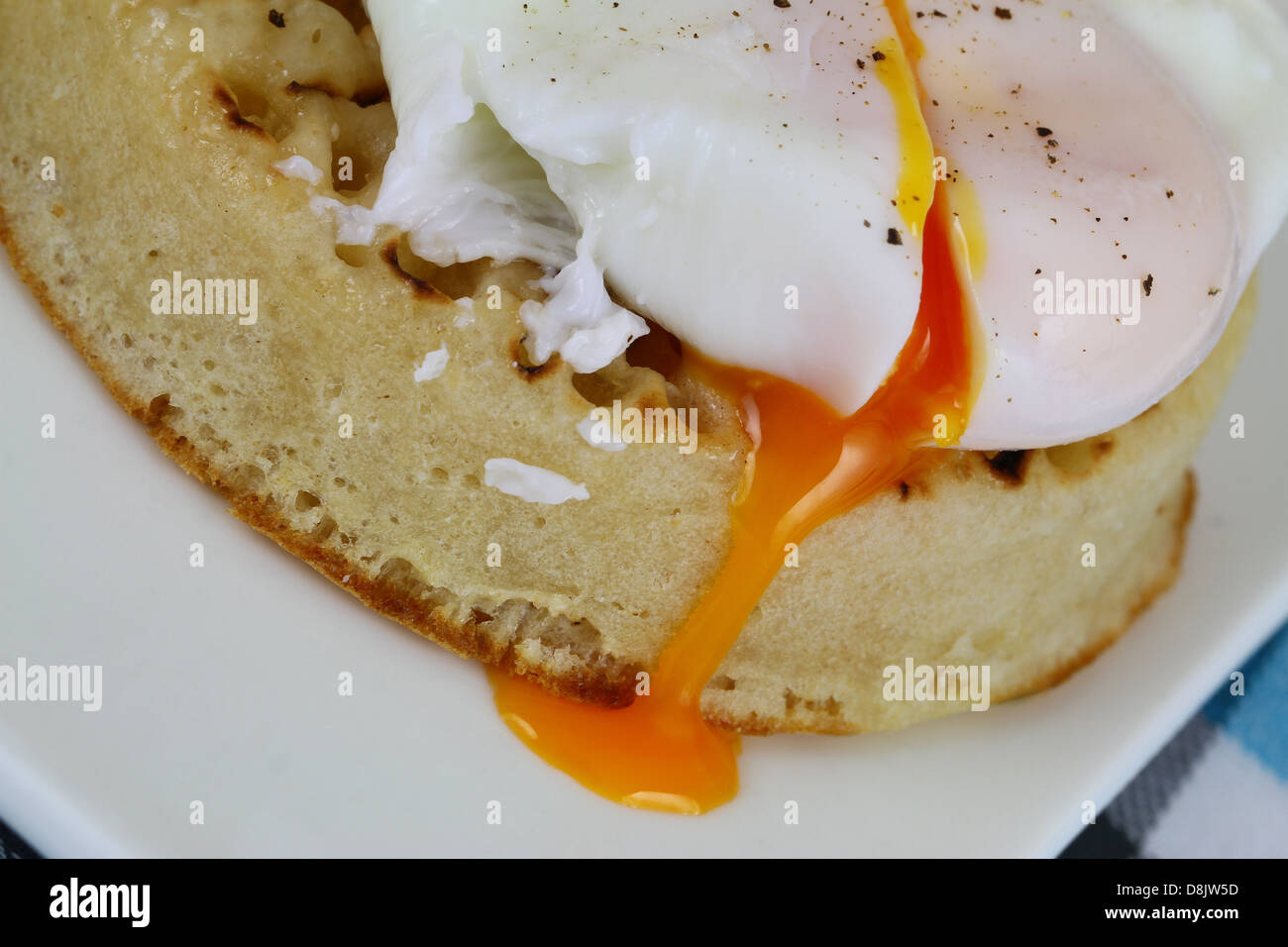 Crumpet with poached egg Stock Photo