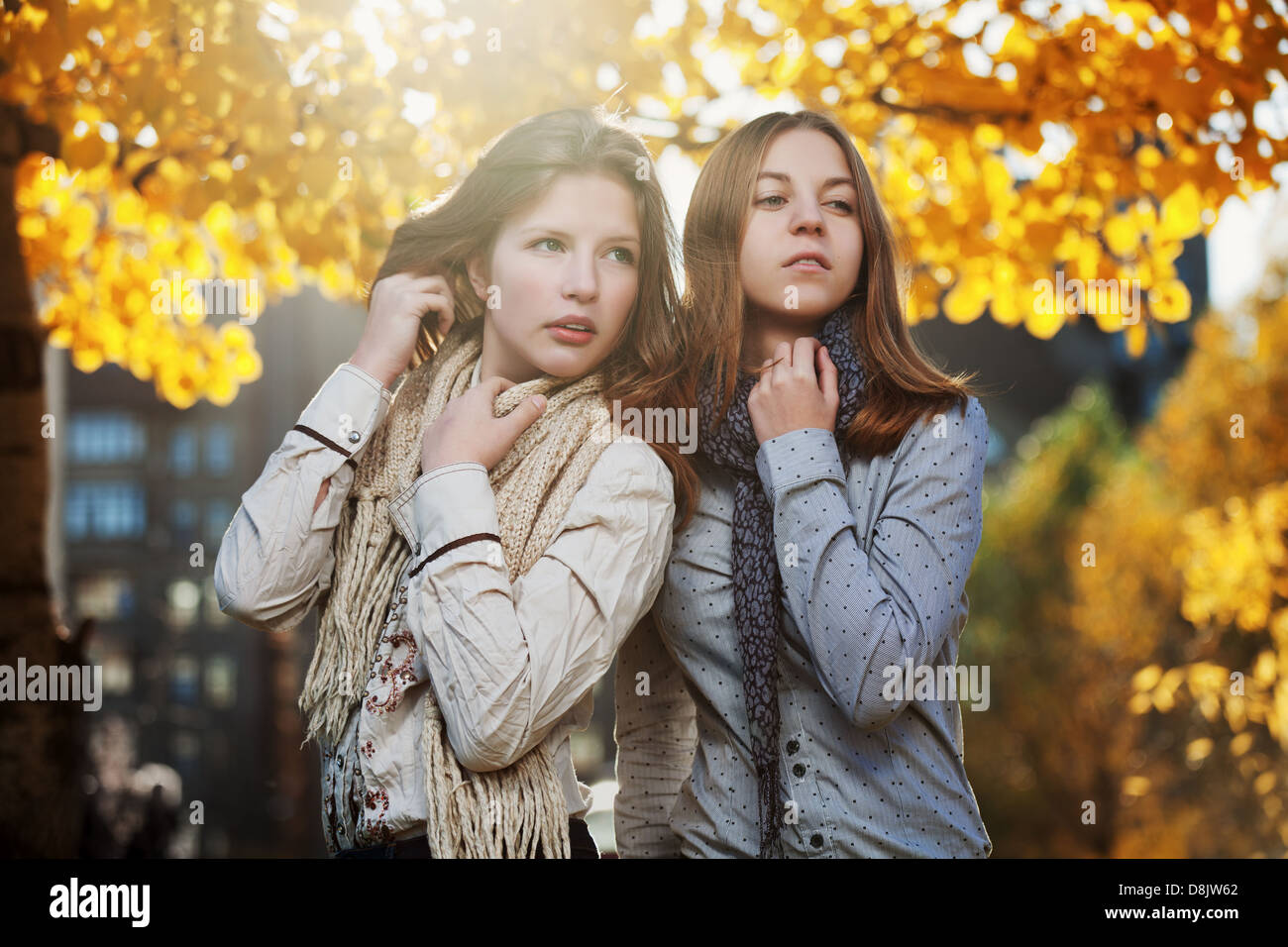 Young girls in an autumn park Stock Photo - Alamy