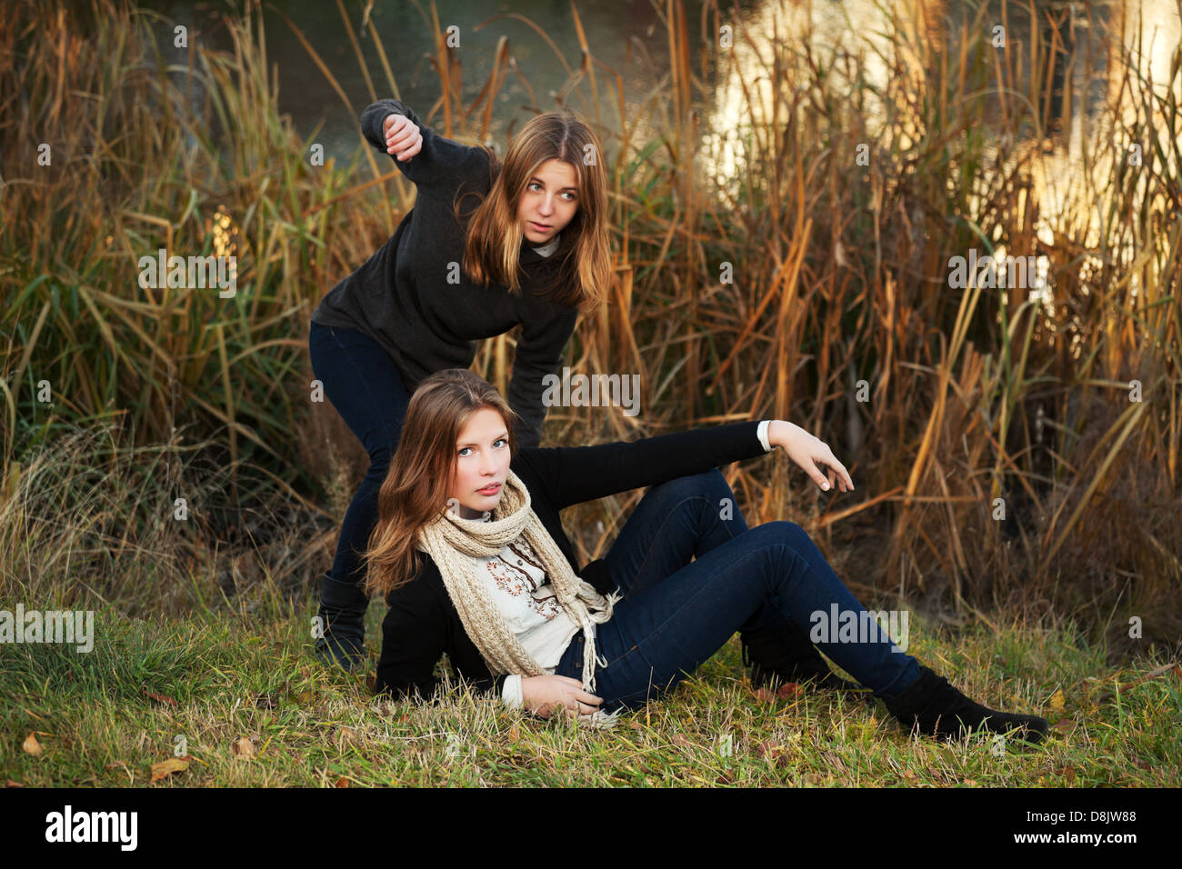 Young girls in an autumn park Stock Photo - Alamy