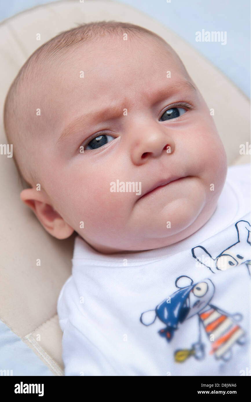 Baby with furrowed brows Stock Photo