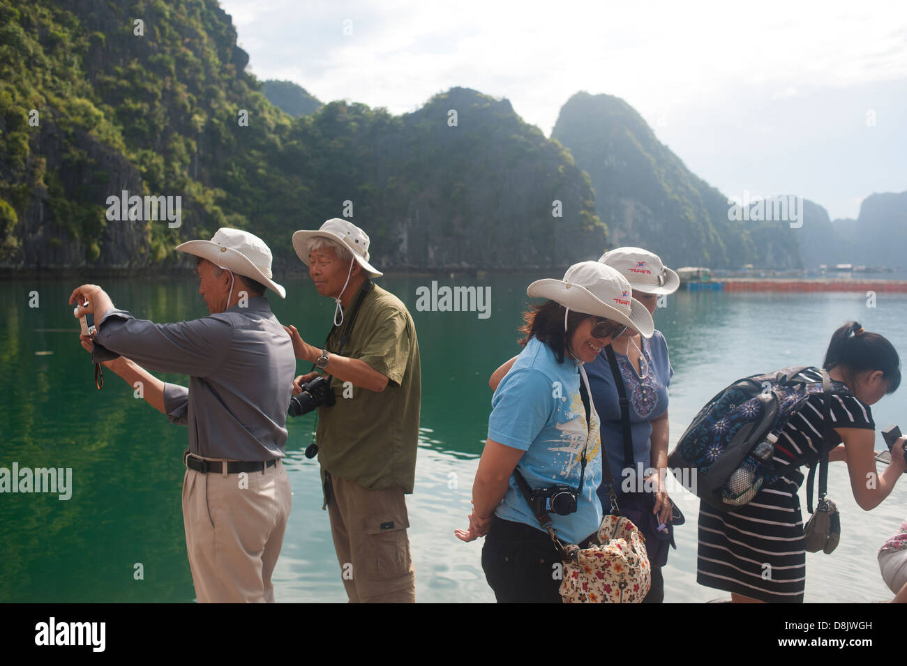 Halong Bay, Vietnam - Chinese tourists visiting floating village Stock Photo