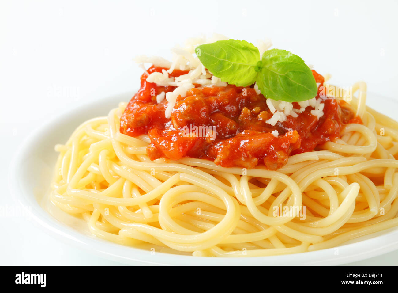 Spaghetti with meat-based tomato sauce and cheese Stock Photo