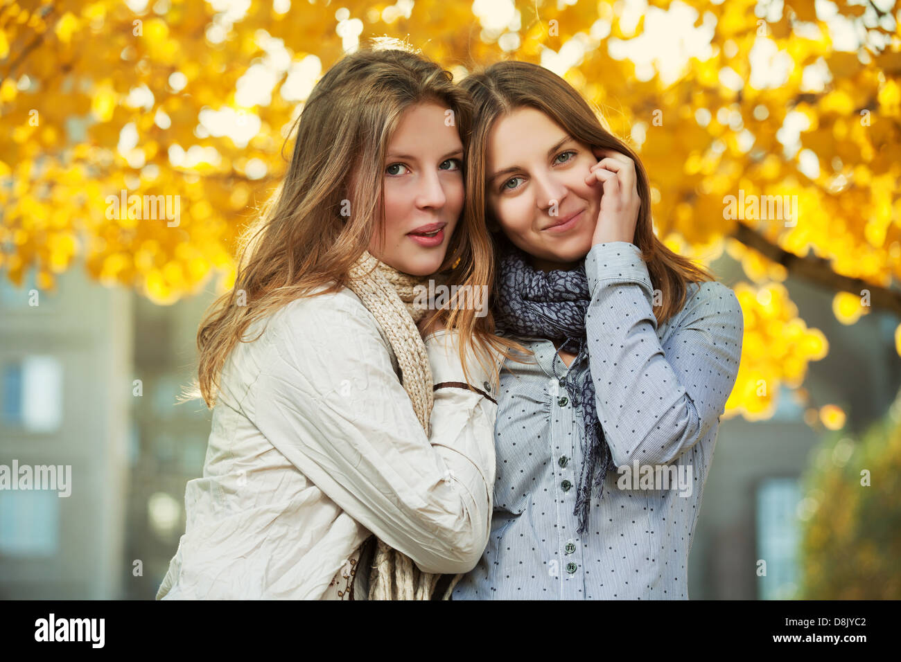 Young girls in an autumn park Stock Photo - Alamy