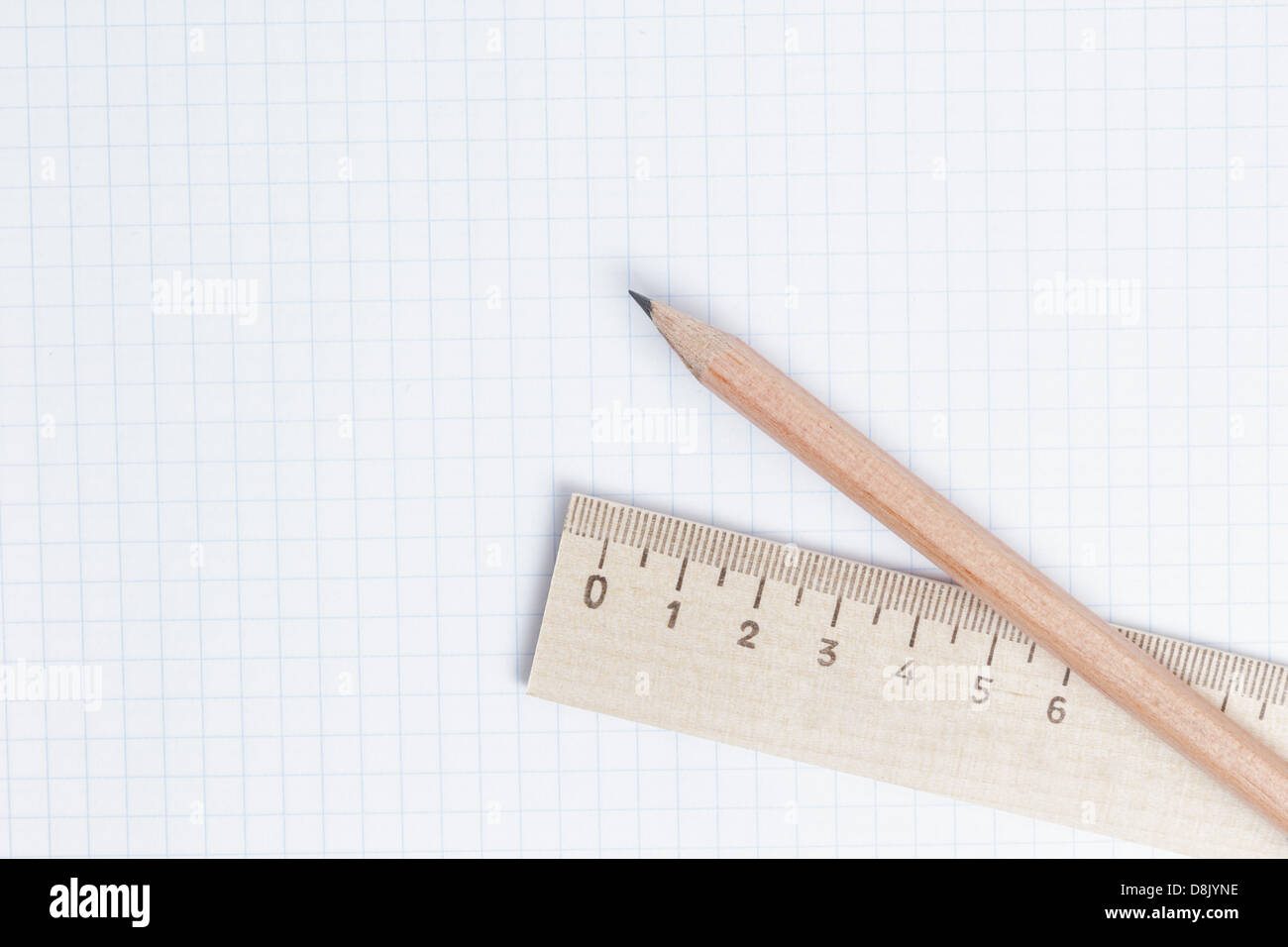 pencils and ruler on notebook page, school or business background Stock
