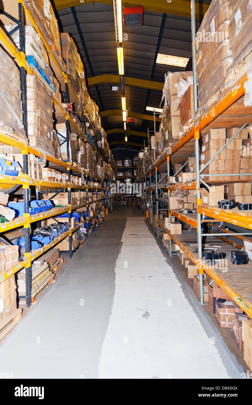 Large Warehouse with cardboard boxes pilled high on racking system