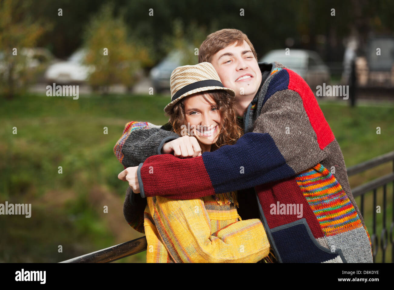 Happy young couple in autumn park Stock Photo - Alamy