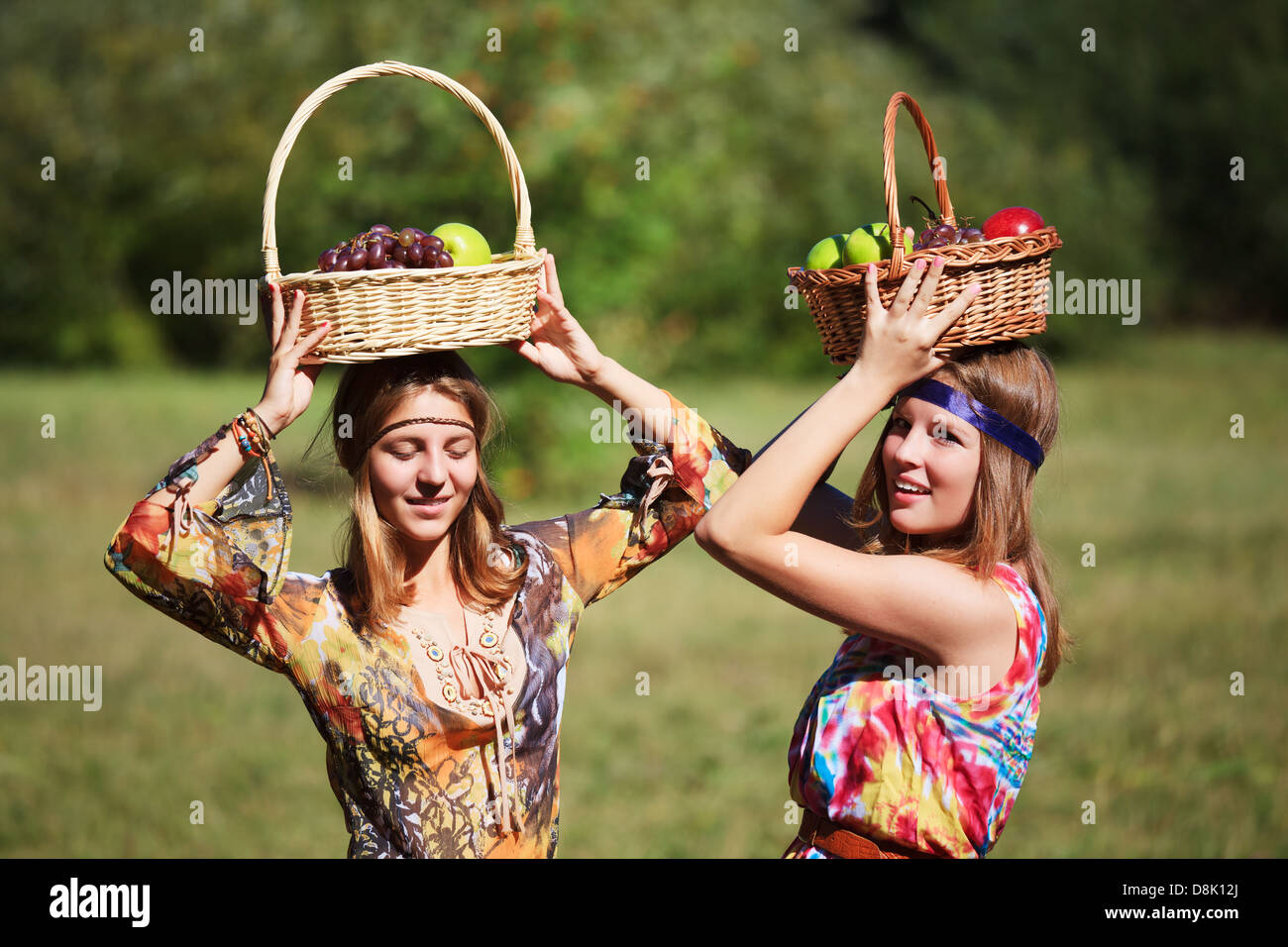 Young girls with a fruit basket Stock Photo - Alamy