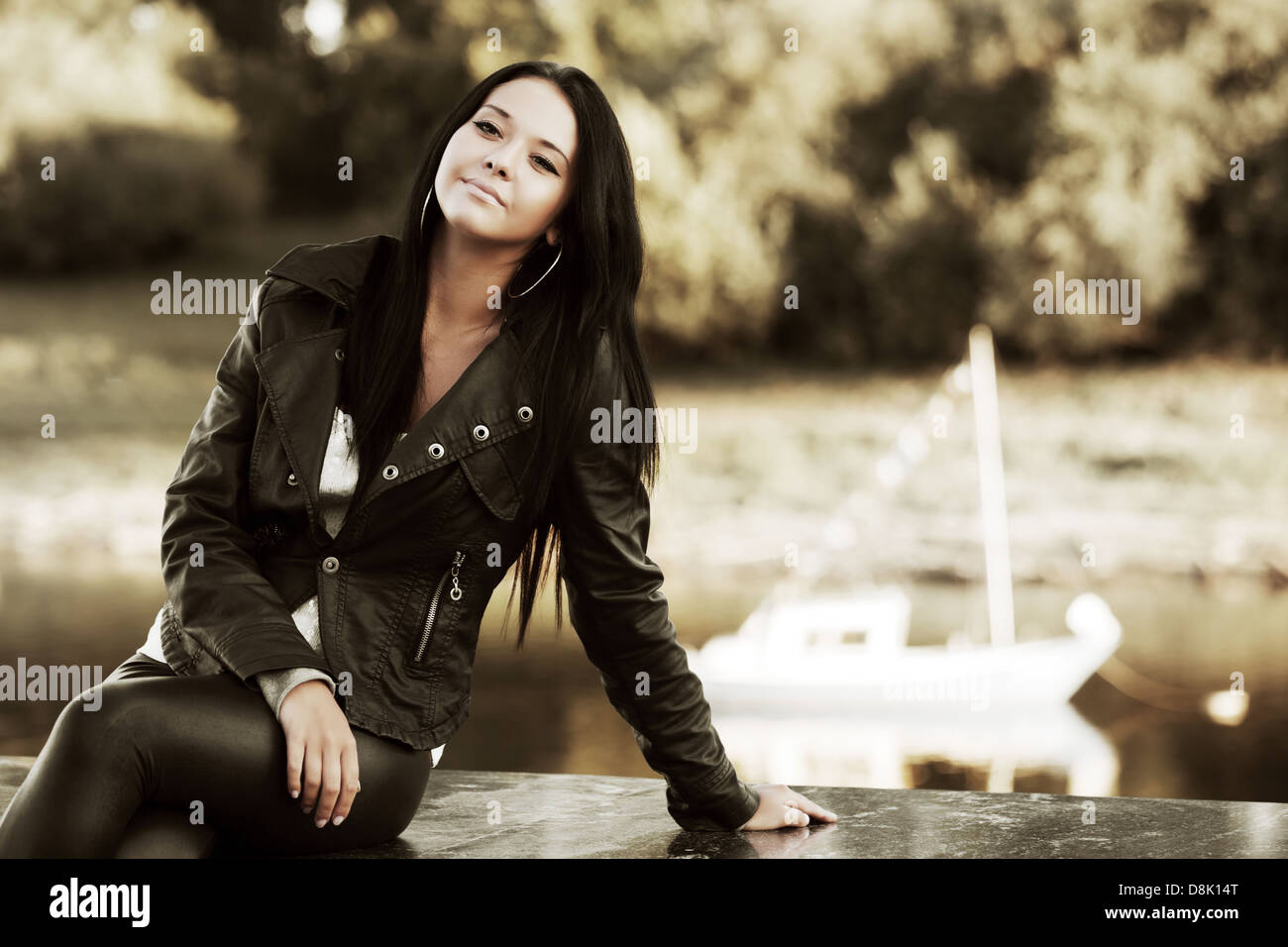 Young woman against a river Stock Photo - Alamy
