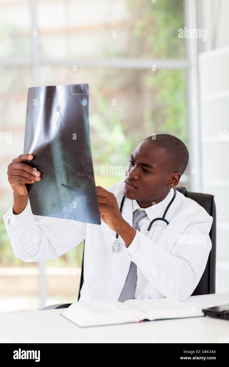 African American doctor diagnosis patient's x-ray Stock Photo - Alamy